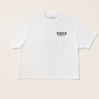 A white short-sleeve t-shirt with a black 'BLADESOR' logo printed on the left chest, displayed flat against a light beige background.