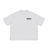 Beige t-shirt with a black and gold graphic on a white background