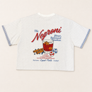 A white short-sleeve t-shirt with a light blue gingham pattern, featuring a retro-style 'The Negroni' cocktail graphic on the front. The graphic includes red and blue text, a glass of red drink, and illustrations of a cinnamon stick and blueberries.